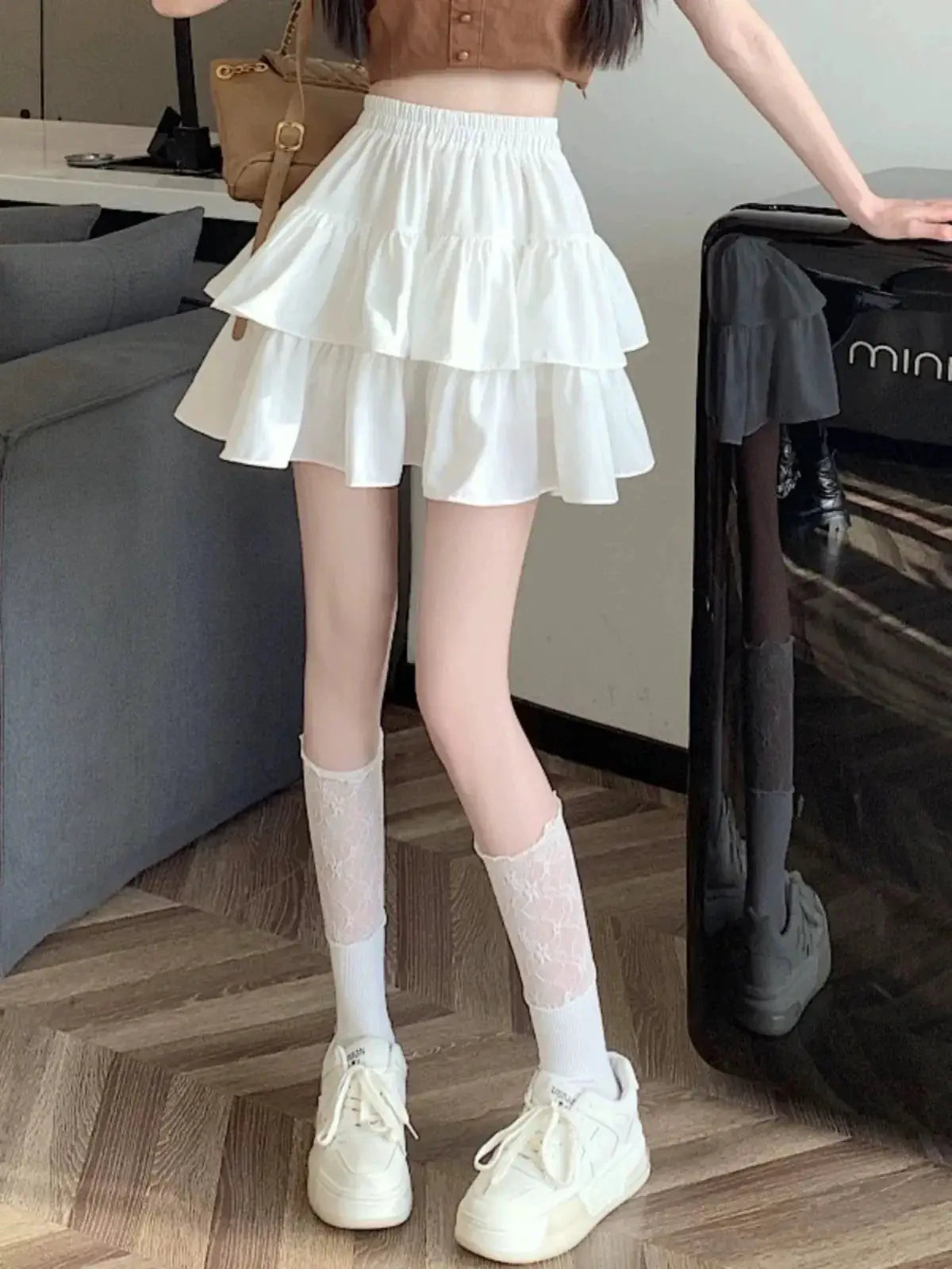 White tiered mini A-line skirt with double ruffle layers, high waist