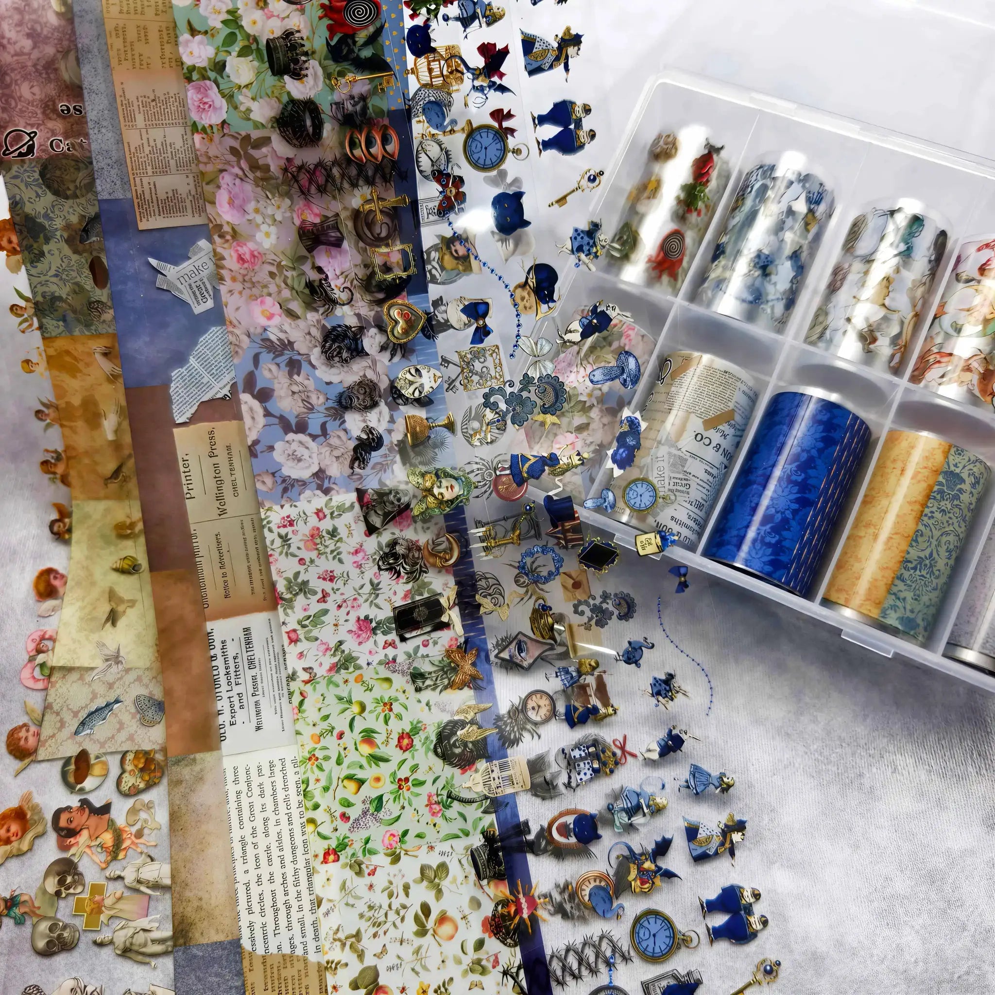 Nail art stickers and foils set by Simples Market; floral, plaid, angel marble and bow designs in assorted colors.