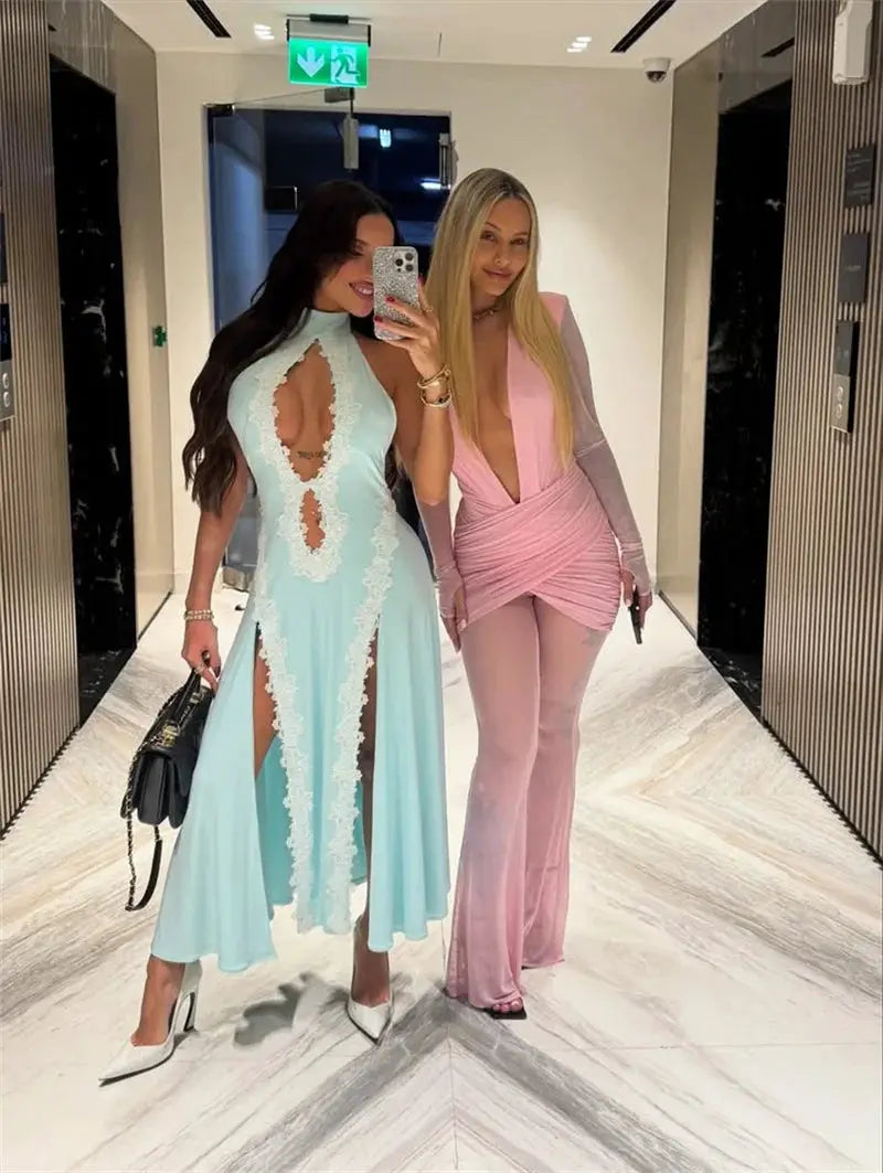 Party outfits: two women pose in a hallway in a light-blue lace-cutout dress and a pink deep-V ruched jumpsuit.