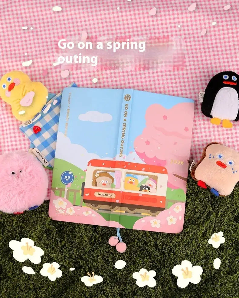 Kinbor 2026 weekly planner pocket-size notebook by Simples Market; pastel blue cover with cloud and bus illustration.