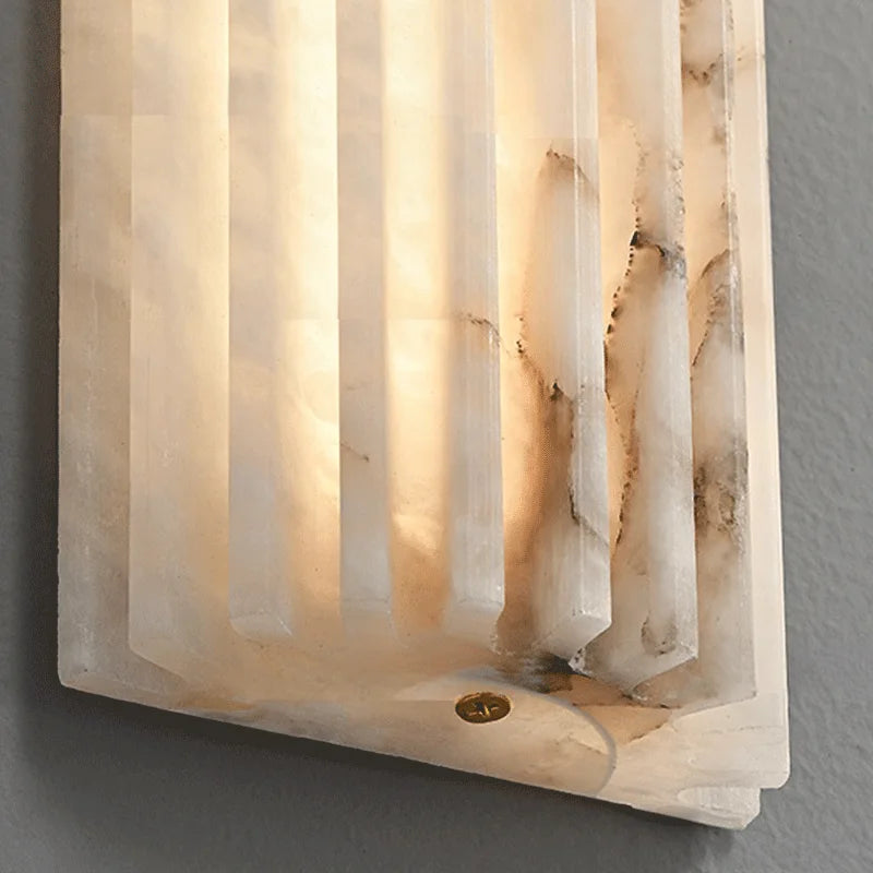 Marble wall lamp by Simples Market, modern minimalist bedside sconce with ivory-white marble finish.