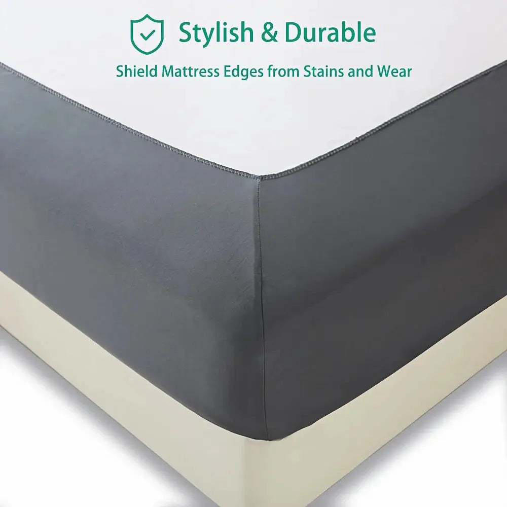 Stretchable bed skirt in dark gray by Simples Market with non-slip edge, machine washable.