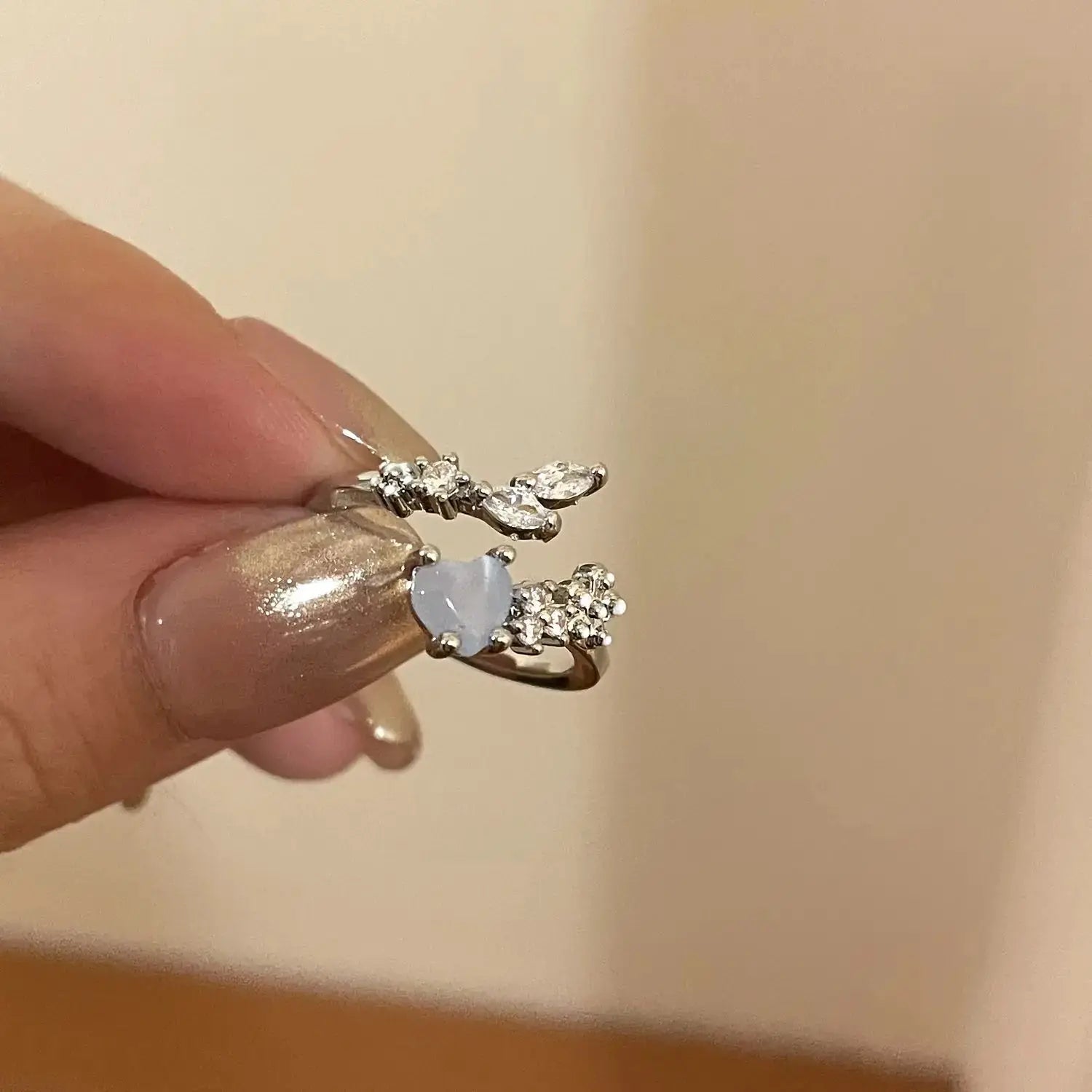 Simples Market goth punk open ring set; two silver-tone rings with a pale blue heart and crystal clusters.