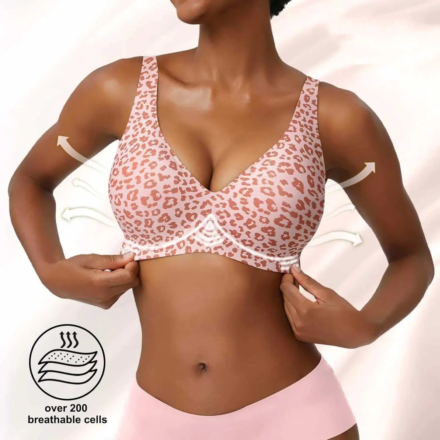 Women's pink leopard print seamless wireless bra with full cups and soft molded support; breathable fabric.