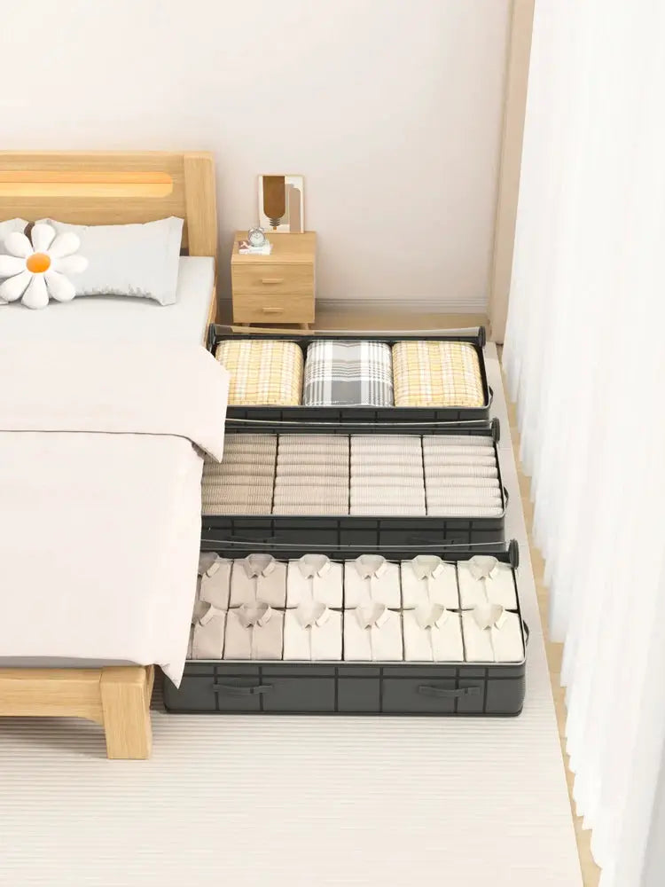 Under-bed black rolling storage drawers with folded quilts and clothes