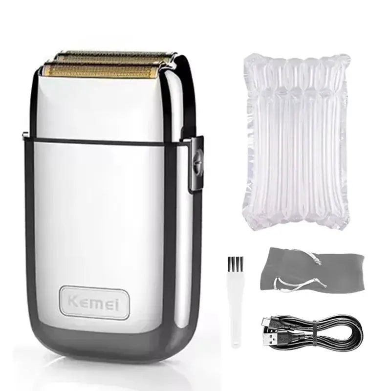 Kemei hair clipper KM-TX1 metal body rechargeable men's shaver in gold and silver with USB cable, cleaning brush, and storage pouch.