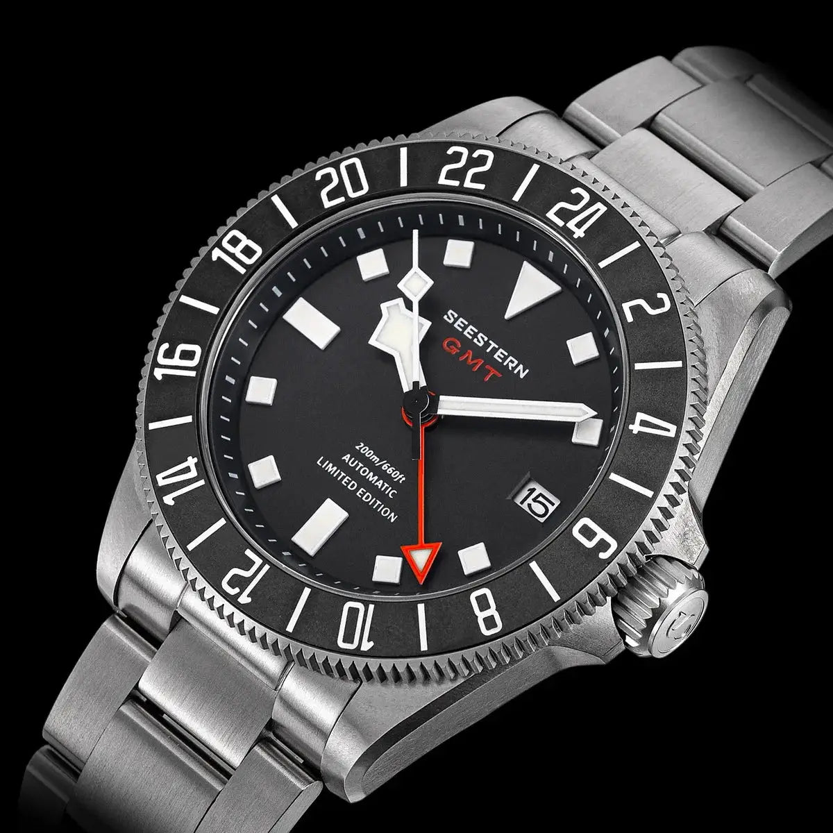 Seestern GMT diver watch with stainless steel bracelet, black dial, white markers, red GMT hand, date window.