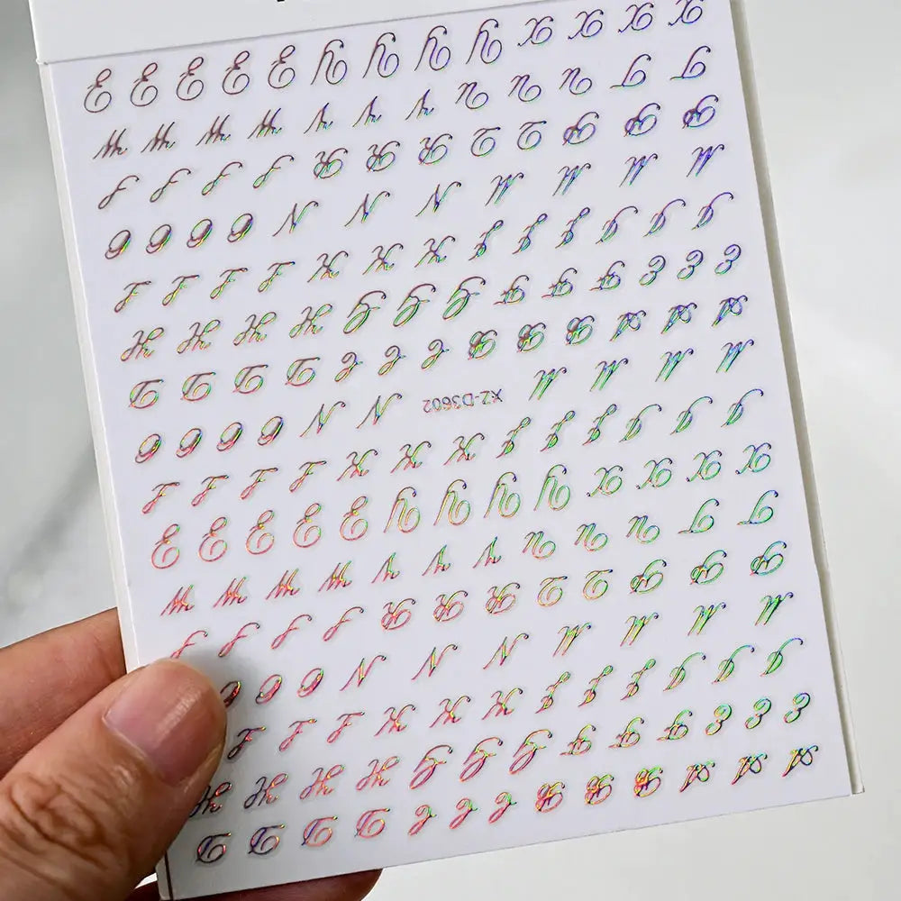 Nail sticker sheet with multicolor holographic Roman letter decals for manicure; self-adhesive cursive alphabet stickers.