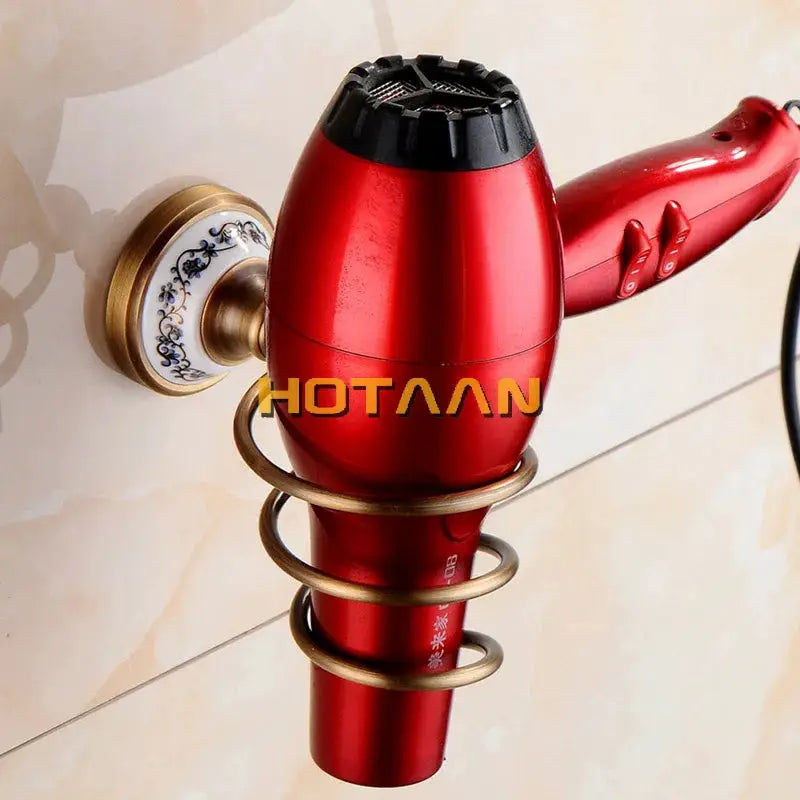 Antique red bathroom fixture with brass spiral guards and porcelain wall plate.