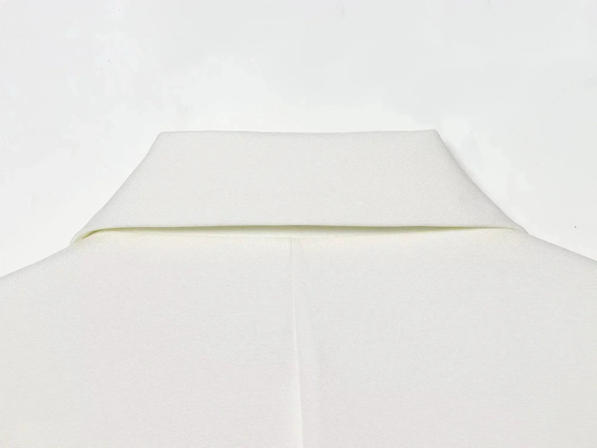 KONDALA white blazer fabric close-up showing textured solid material and seam detail