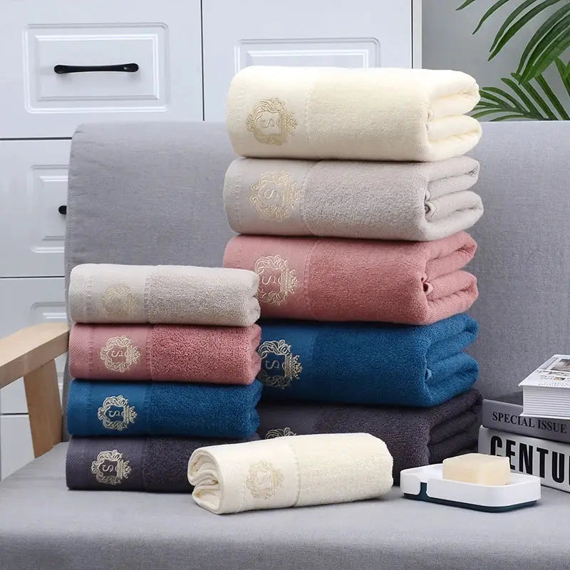 Towel set by Simples Market; assorted-color cotton towels with embroidered crest for bathroom, gym or hotel.