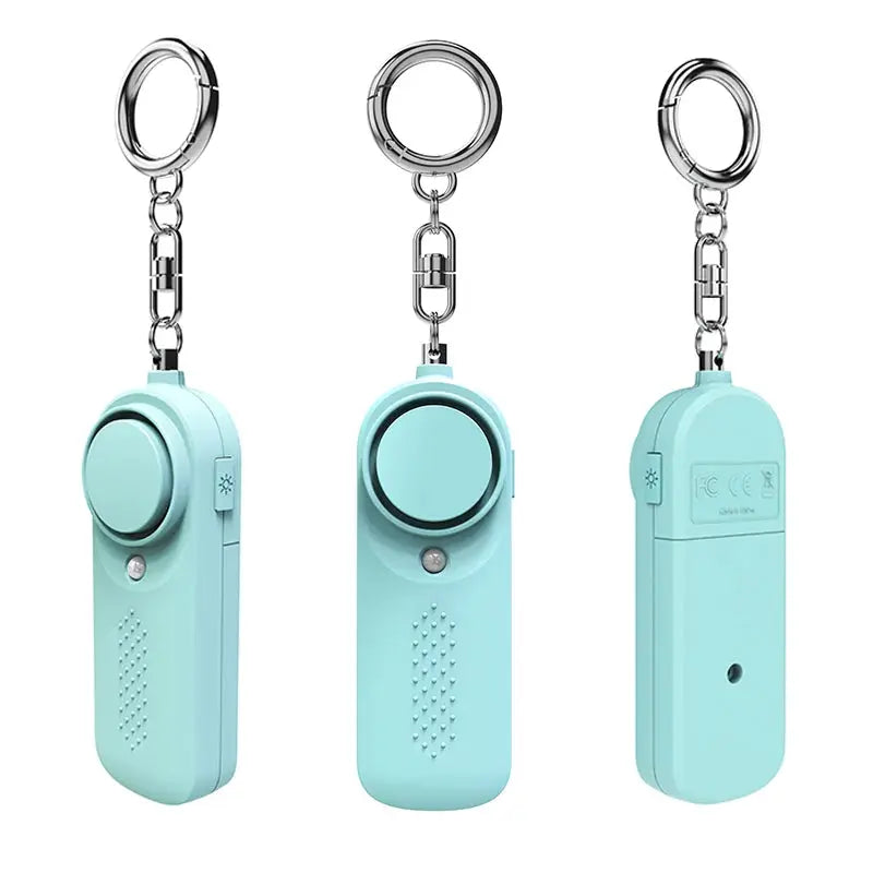 Protect Alert personal defense siren keychain by Simples Market in teal, three angle views