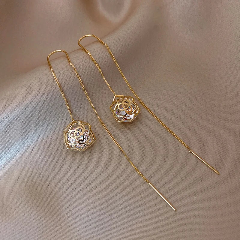 Drop earrings with gold-tone long chain and filigree crystal bead pendants, pair