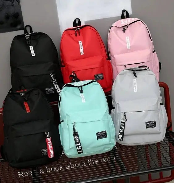 Six Simples Market fashion trend backpacks in black, red, pink, mint, gray; Korean version for men and women.