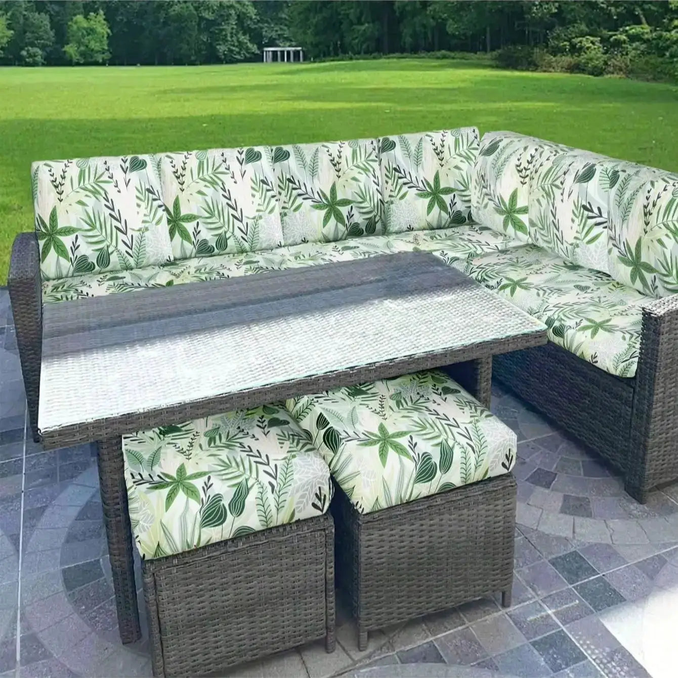 Simples Market outdoor tropical print sofa cushion covers on a wicker sectional with matching ottomans