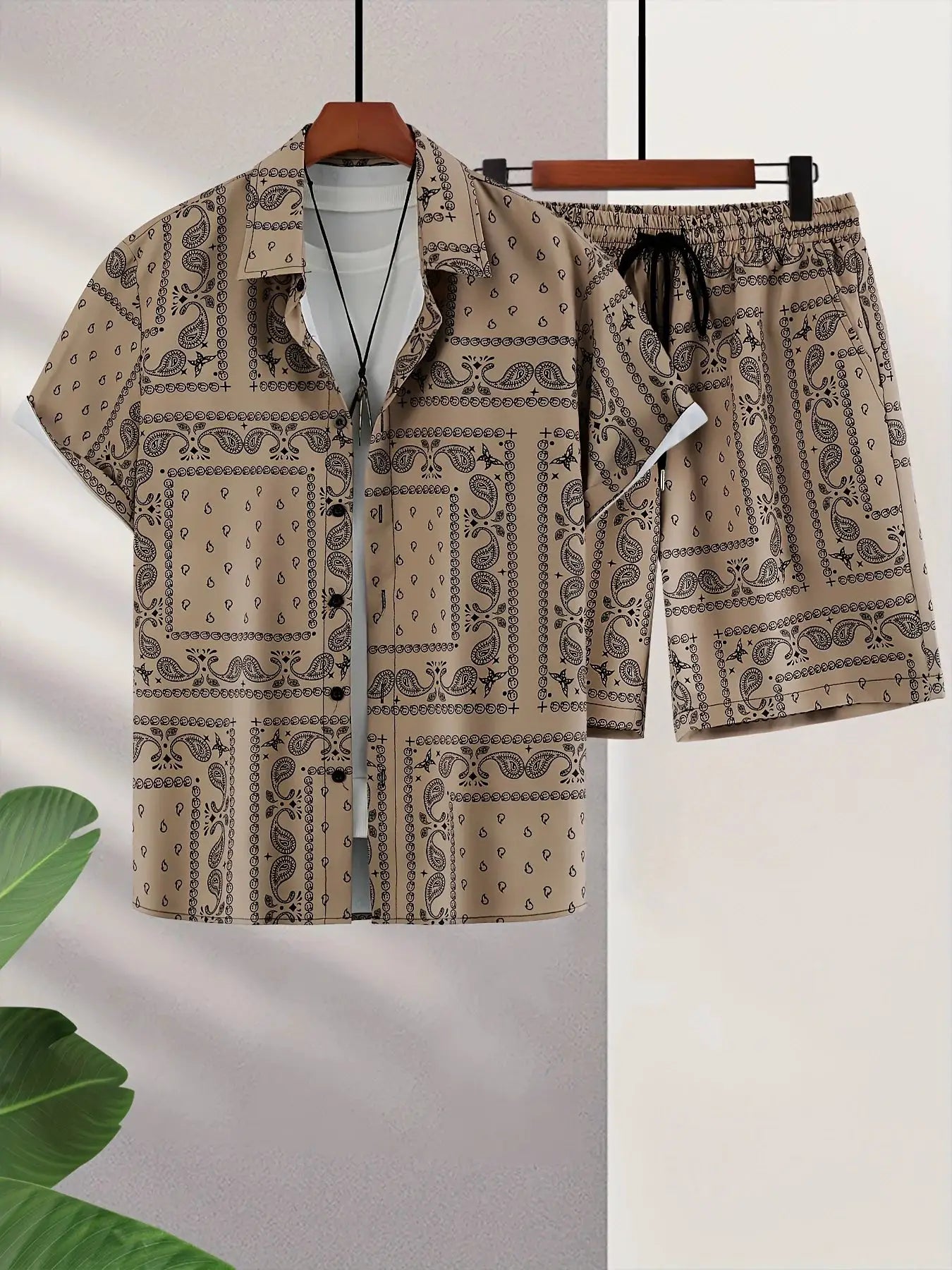 Trend Bandana graphic two-piece beach set for men in beige with black paisley print.
