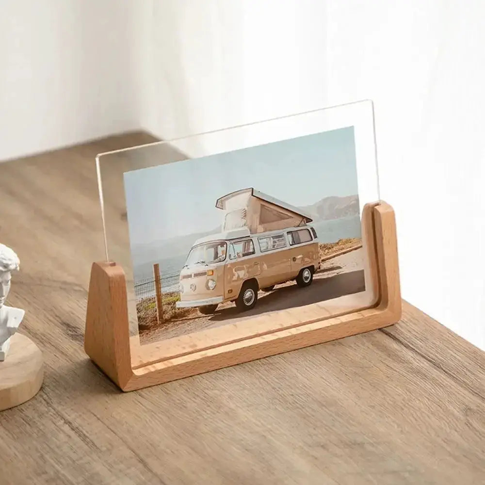 Photo frame walnut and beech wood with clear acrylic U‑shape on a desk, displaying a camper van photo.