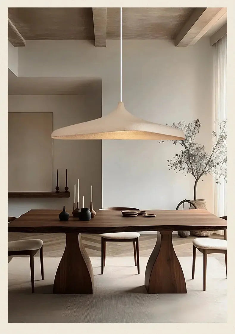 LED pendant light with a beige shade, Japanese wabi-sabi style, over a wooden dining table.