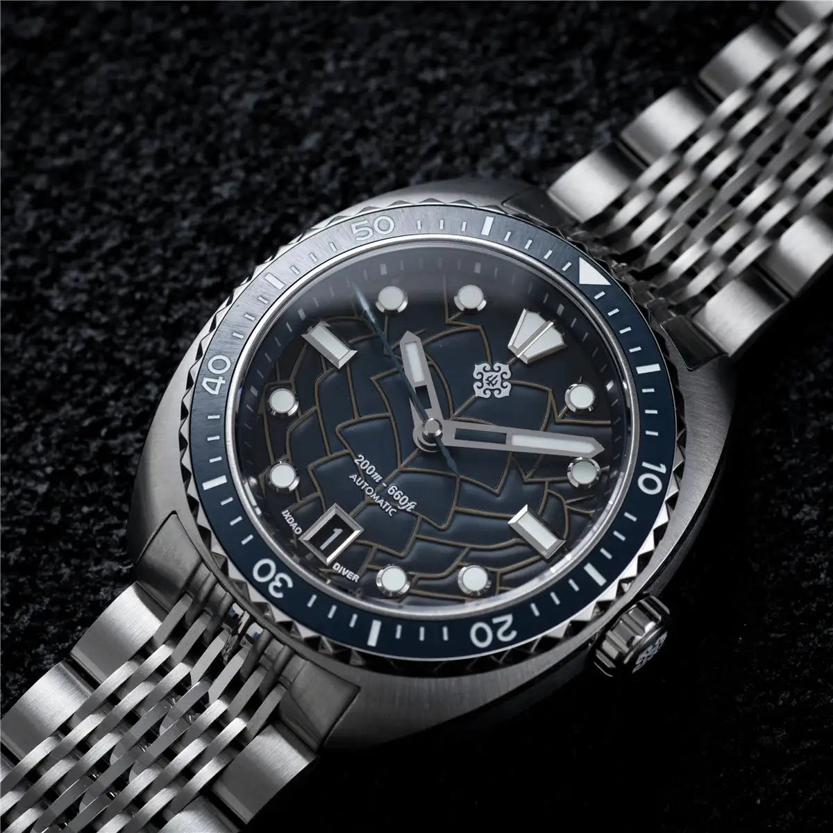 IXDAO IPOSE 2026 men's automatic diving watch with Poseidon pattern, blue dial, stainless steel bracelet.