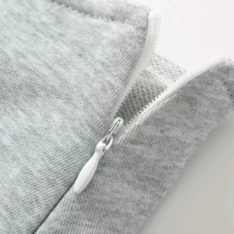 Mooyufon fabric Y2K mini skirt in light grey with white zipper.