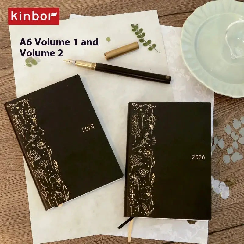 Kinbor 2026 planners: two black floral notebooks (A5 and A6) with 2026 on the covers.