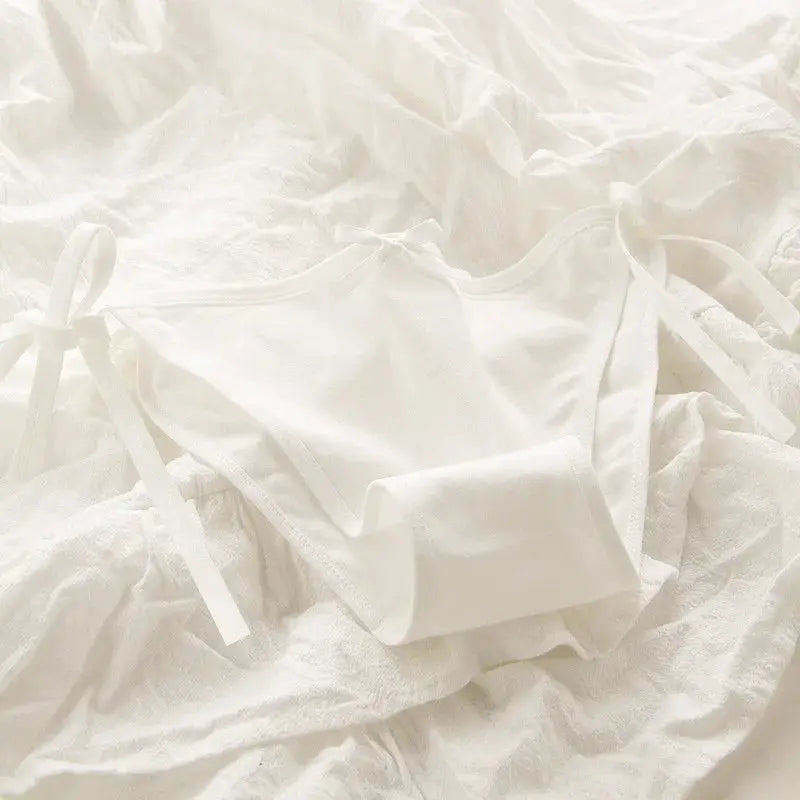 Simples Market white lace-up briefs with side bows.