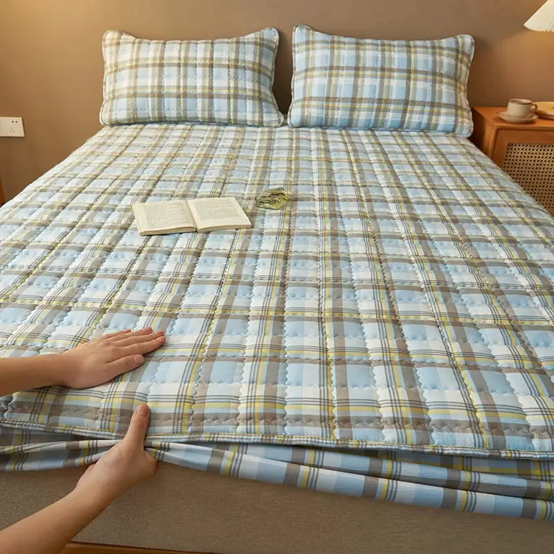 Quilted plaid mattress protector from Simples Market, light blue and beige plaid, breathable antibacterial cover