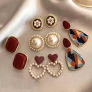Wine-red retro Hong Kong style earring set, five pairs by Simples Market with pearl halo studs and geometric teardrops.