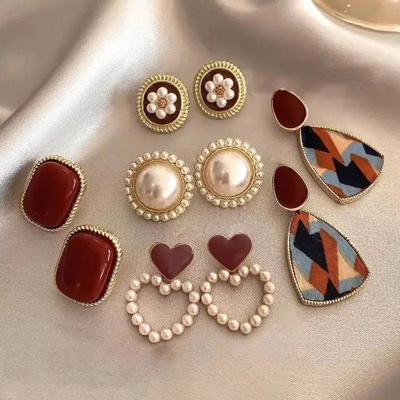 Wine-red retro Hong Kong style earring set, five pairs by Simples Market with pearl halo studs and geometric teardrops.