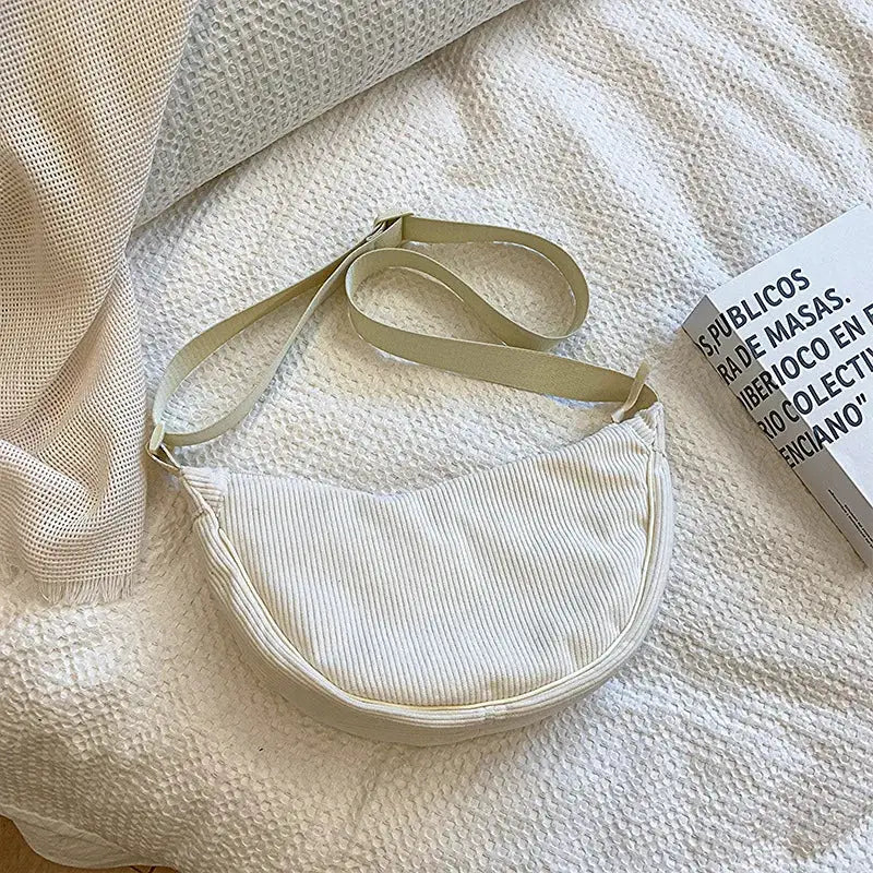 Corduroy hobo shoulder bag by Simples Market in cream with long crossbody strap