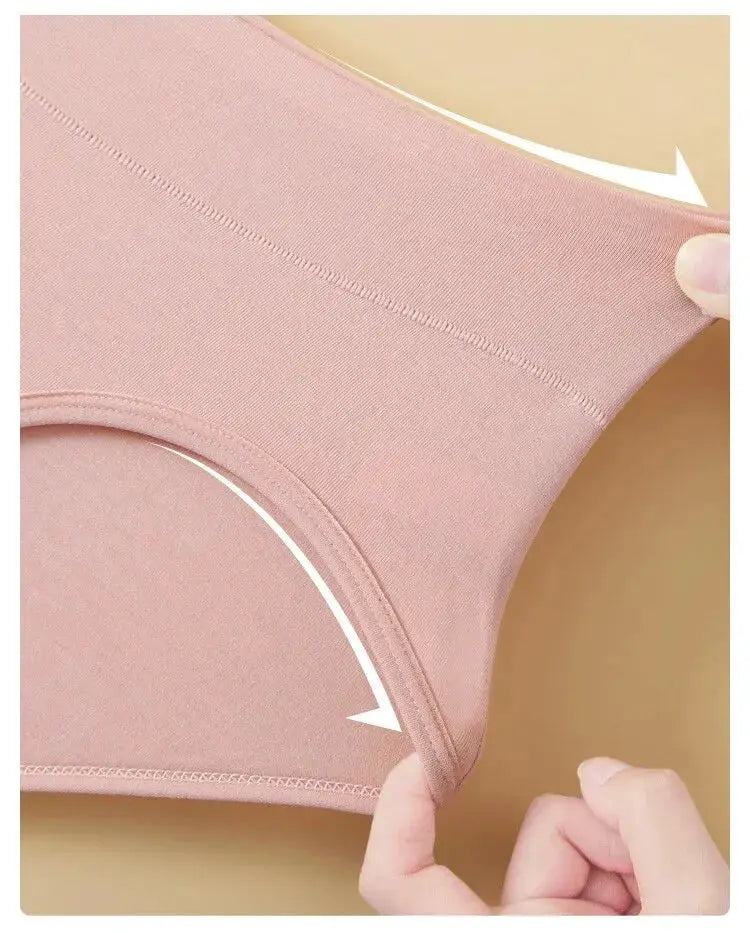Women's high-waist cotton panties in soft pink, seamless and breathable.