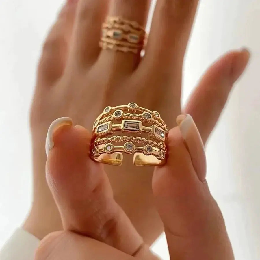 Exaggeration Punk ring set for women; three-layer gold-tone bands with stones, adjustable fit.