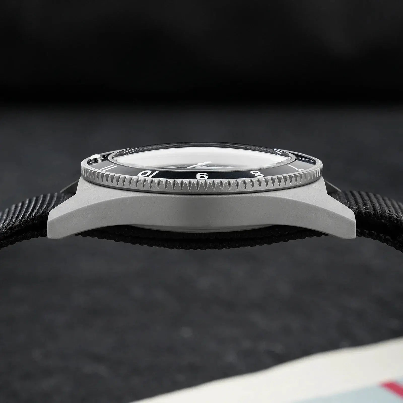 Watchdives WD1972 quartz diver-style wristwatch with a gray case, black bezel, and black fabric strap
