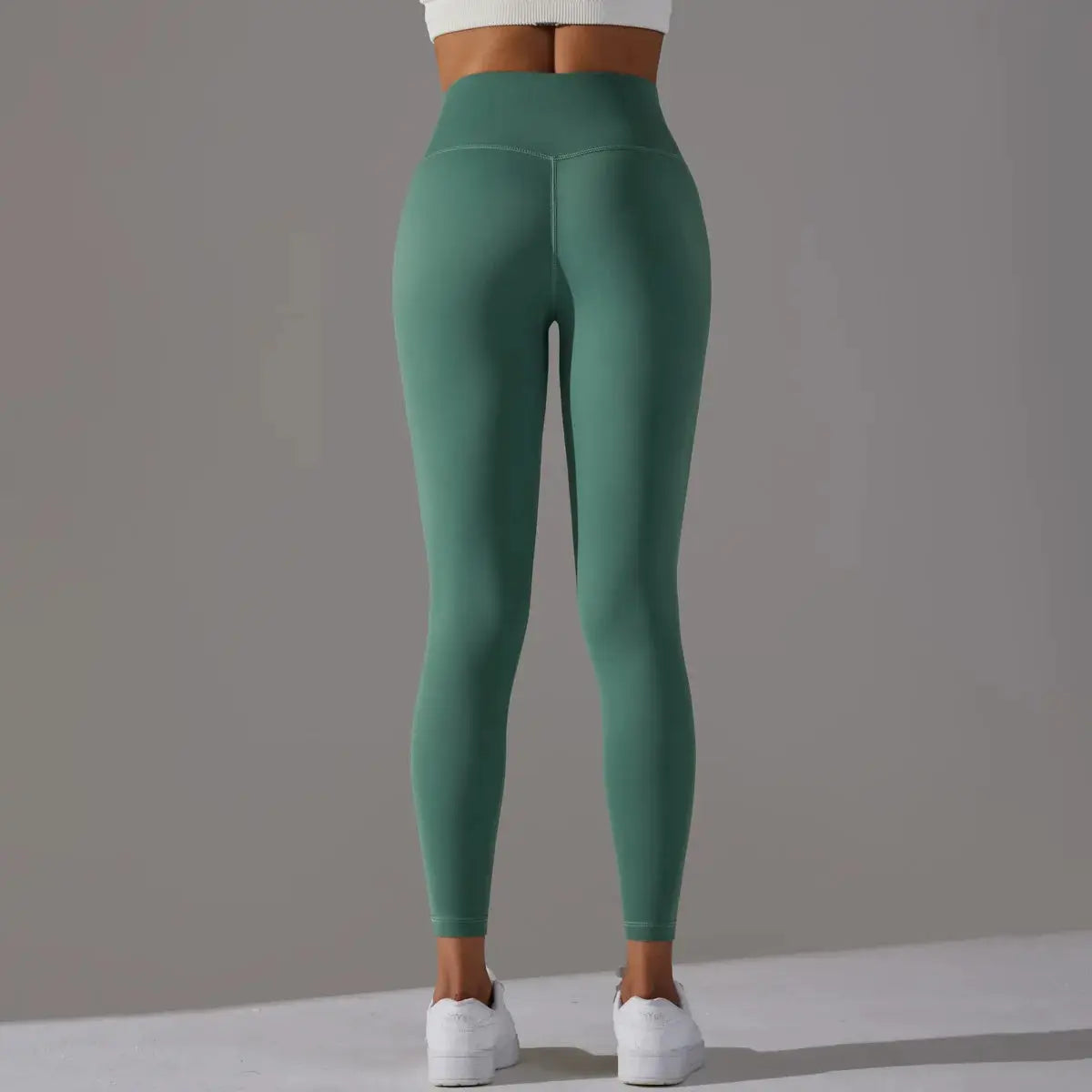Green high-waist leggings for women by Simples Market; gym/yoga fitness bottoms.
