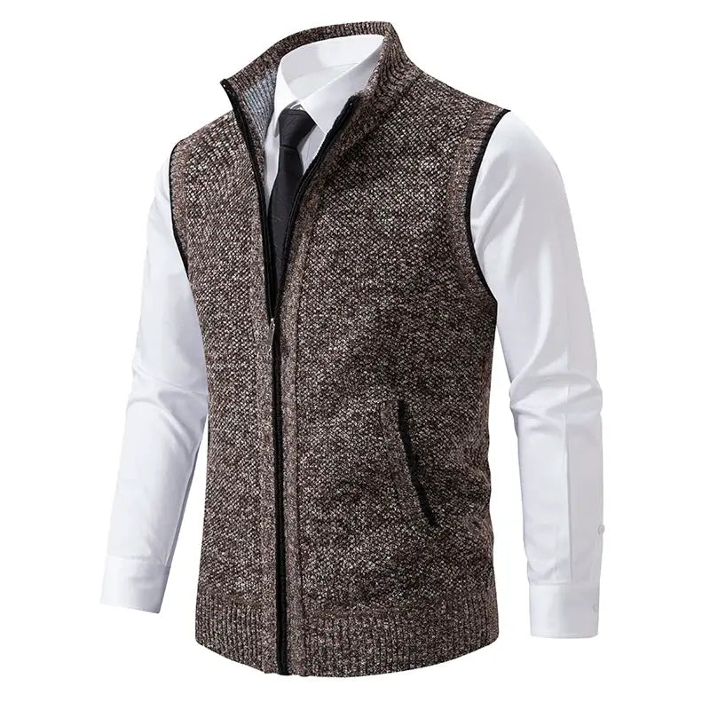 Men's brown knit sleeveless vest with stand collar and front zip worn over a white shirt.