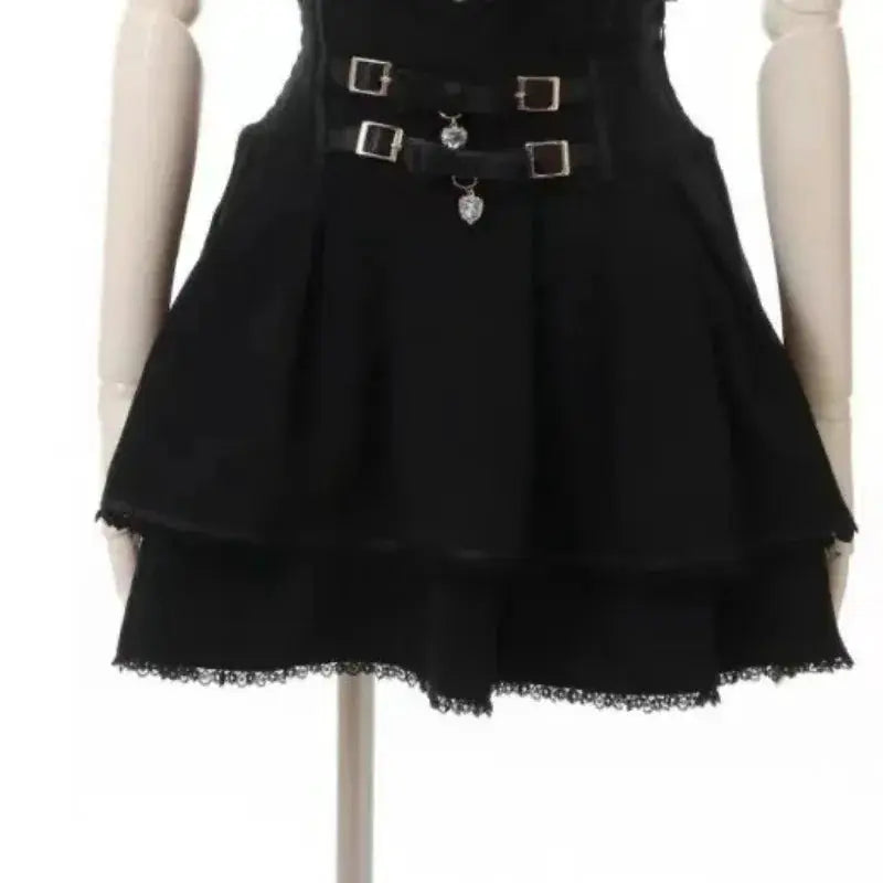Black layered skirt with lace hem and triple-buckle belt on mannequin