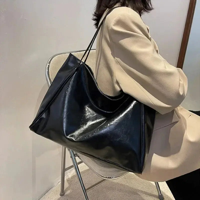 Women's black PU leather tote bag with shoulder strap, large capacity, casual bucket style