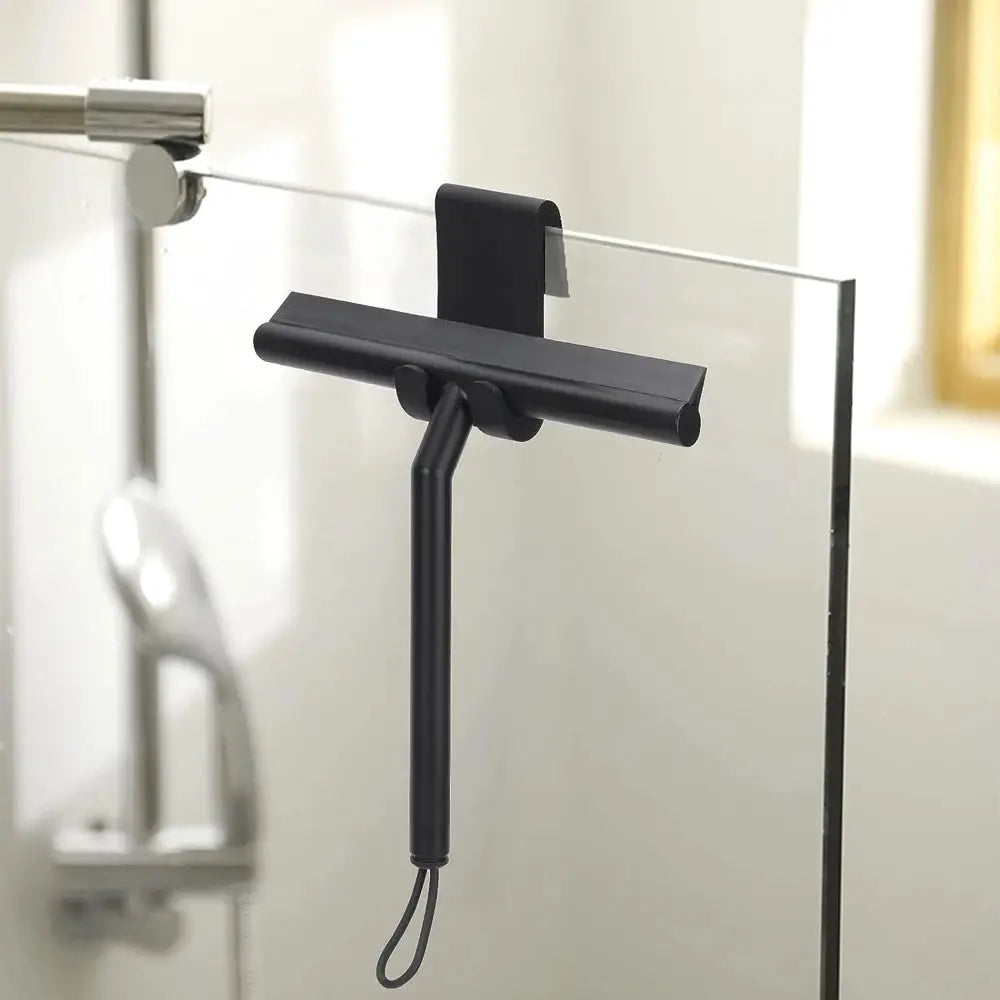 Shower squeegee with silicone holder, black, mounted on glass shower door for cleaning
