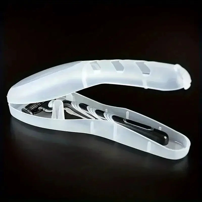 Razor protector case, white translucent plastic, opened to reveal a manual razor inside
