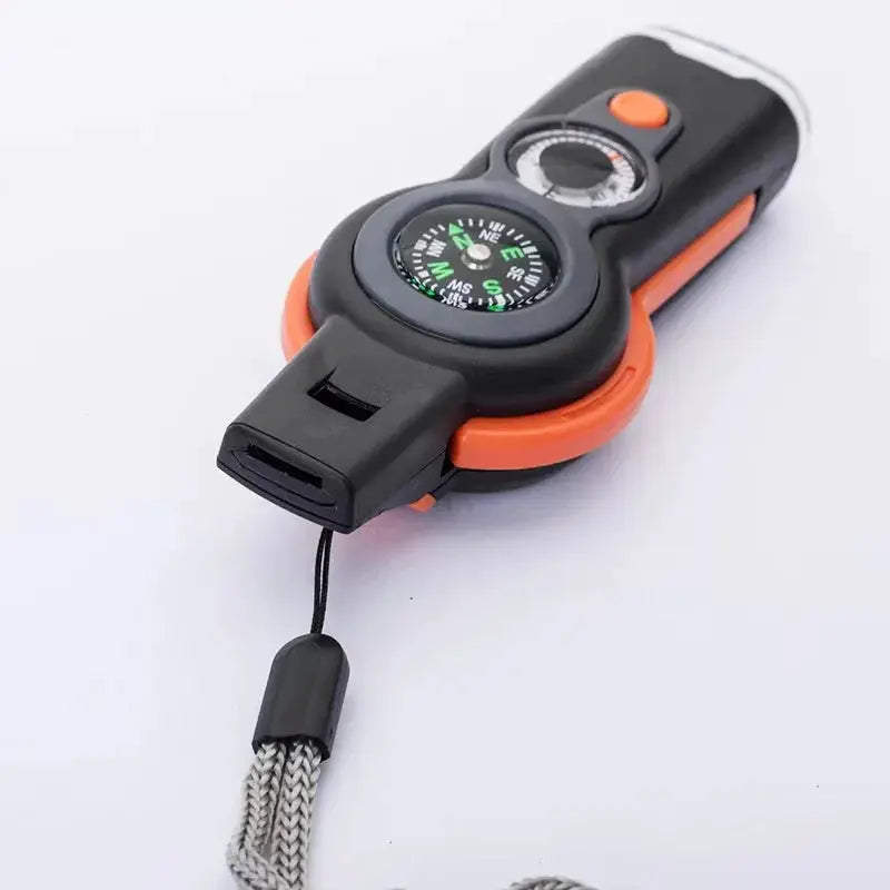 Simples Market 7-in-1 survival whistle with compass, orange accents and lanyard