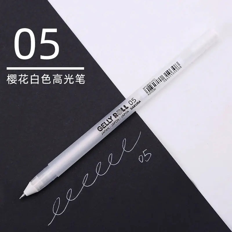 Sakura Gelly Roll white gel pen 05 with white ink, shown diagonally on black and white background