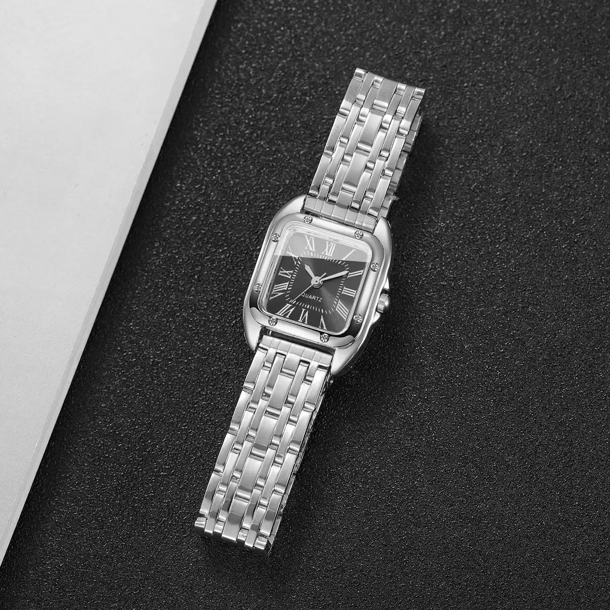 Square women's quartz watch with a silver stainless steel bracelet and Roman numeral dial