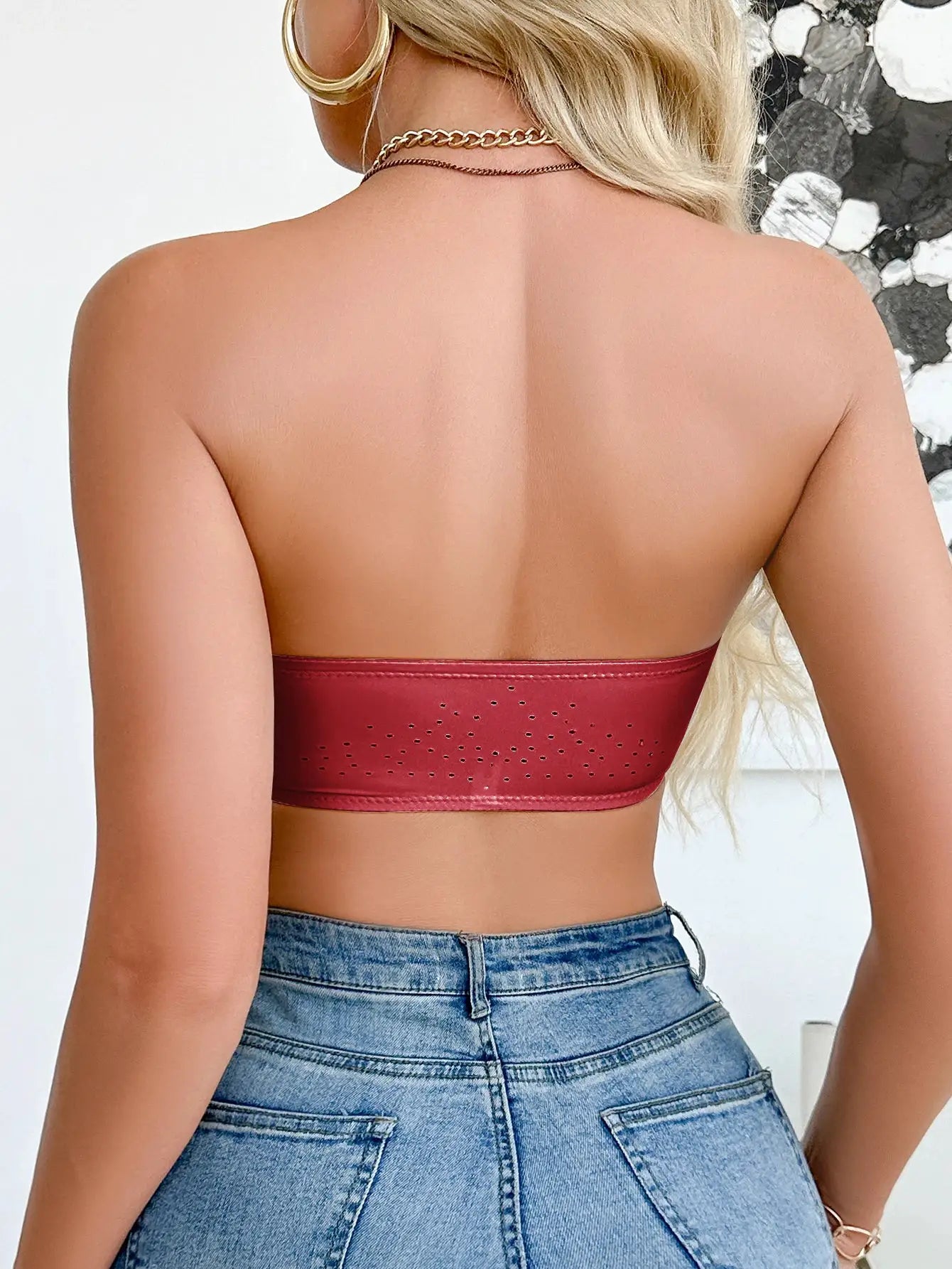 Simples Market red strapless wireless bralette; perforated band detail, back view.