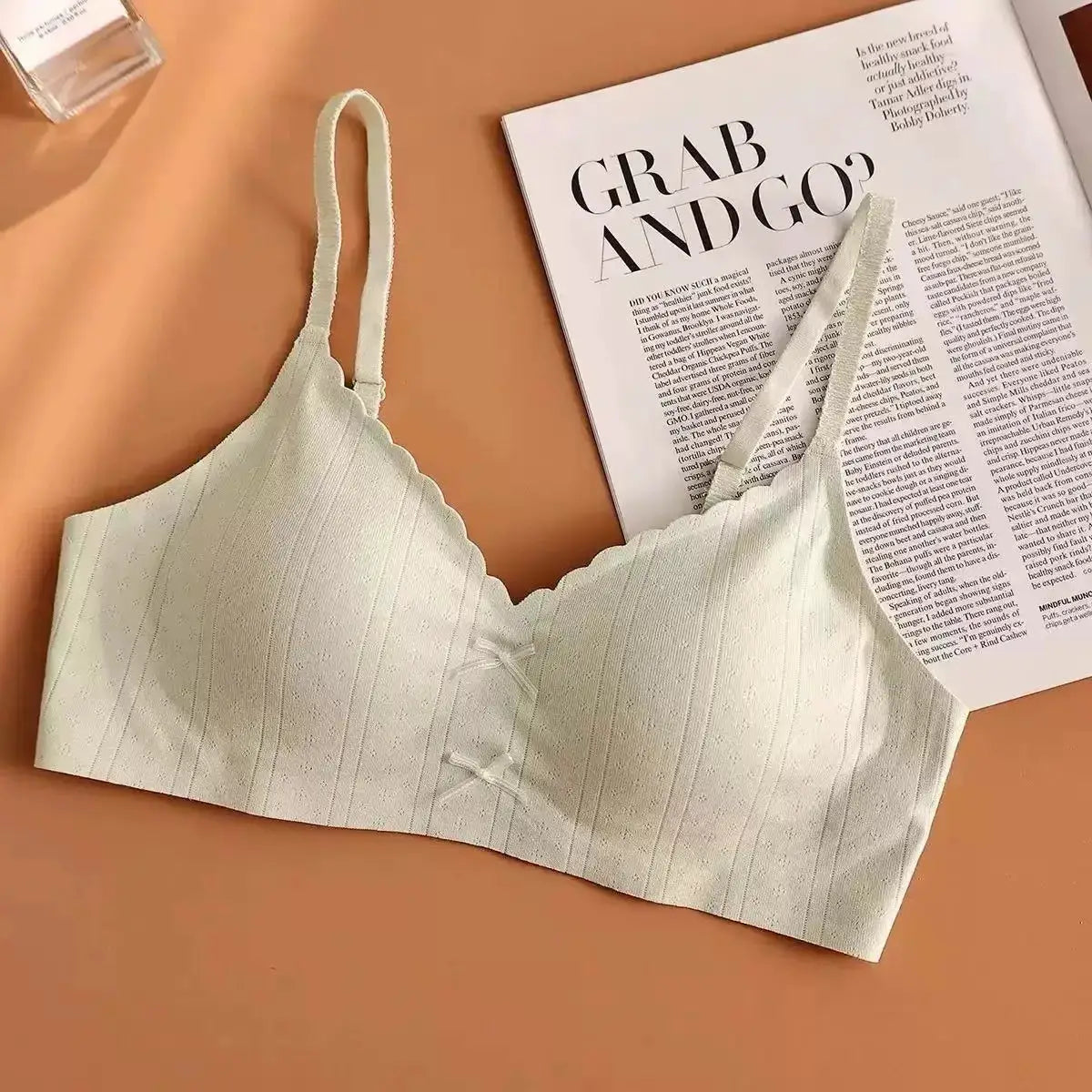 Women's cream ribbed sports bra with scalloped trim and wide straps