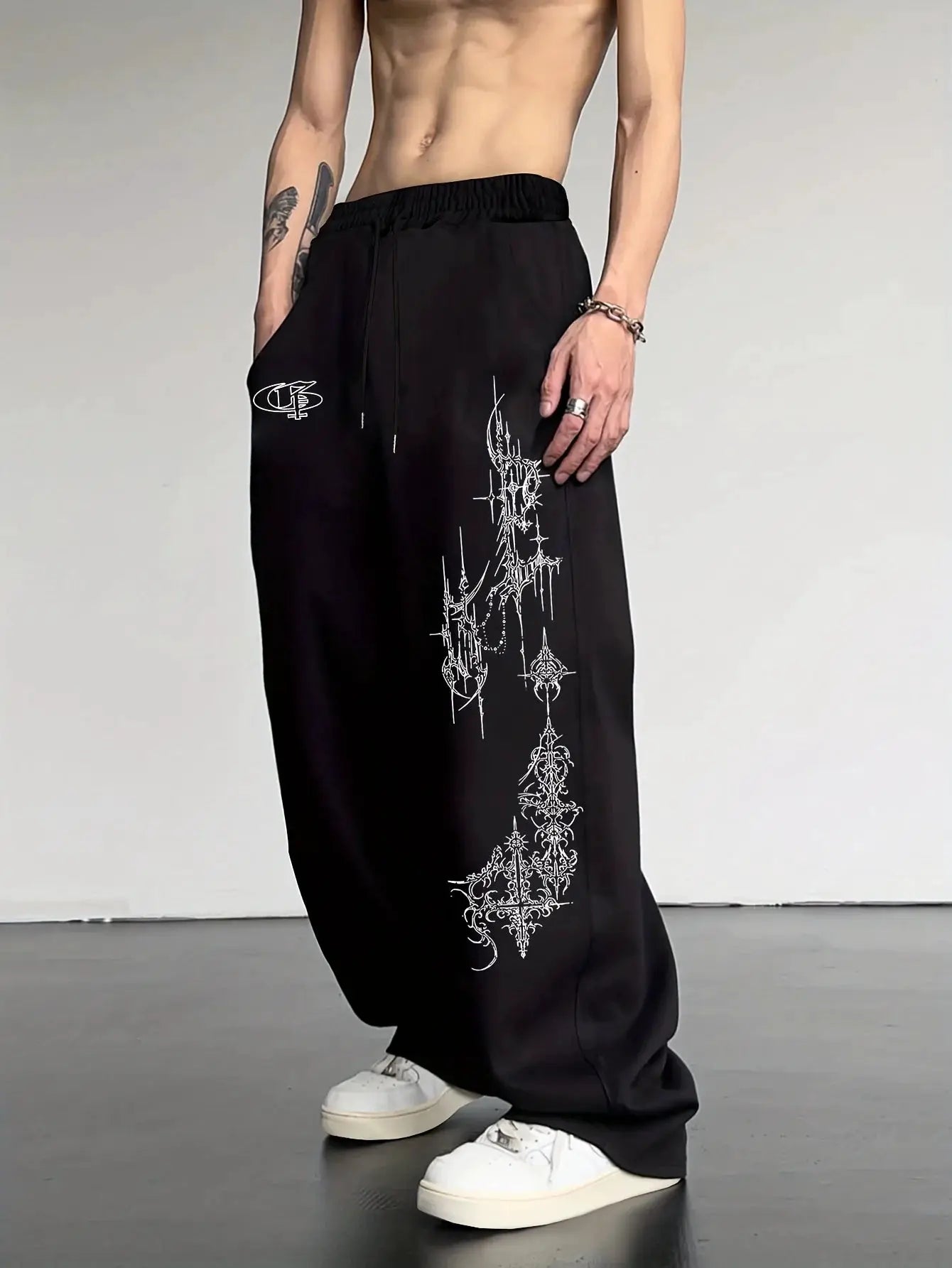 Men's Casual Sports Joggers; black with white spiked cross print along leg, drawstring waist, Simples Market logo.