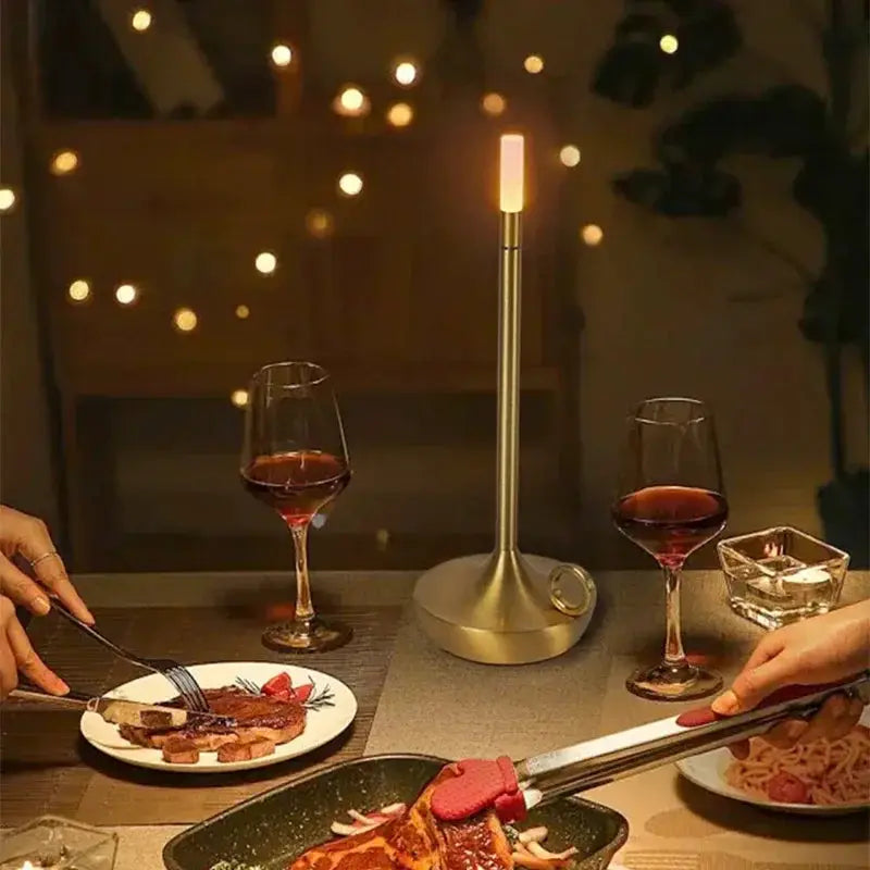 Atmosphere LED Candle USB-Charging table lamp with warm metal finish for restaurant/bar decor.