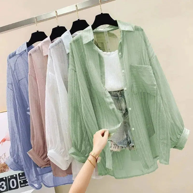 Simples Market pastel chiffon blouse set on hangers; five sheer tops, green one over white tank.