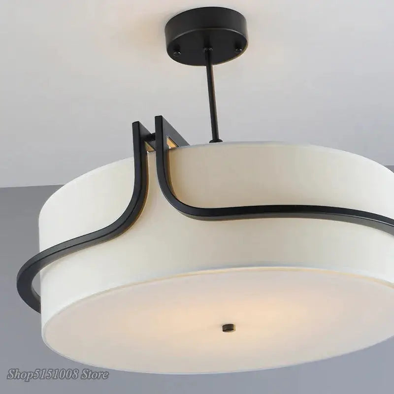 Modern Fabric Art Ceiling Chandelier by Simples Market, white fabric drum shade with black curved metal accents