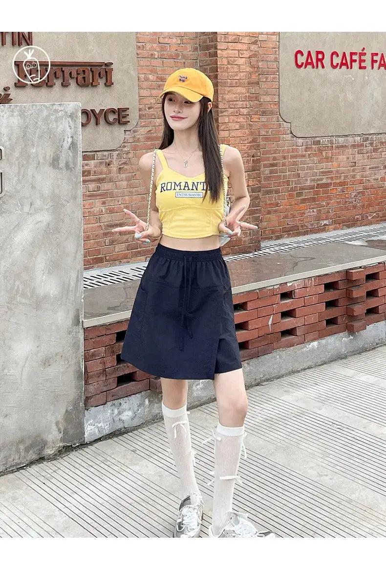 Fake 2-piece shorts-skirt set for women: navy high-waist faux skirt shorts, yellow crop top