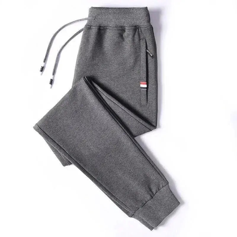 Simples Market men's grey cotton jogger sweatpants with elastic waist, drawstring and zippered side pocket.